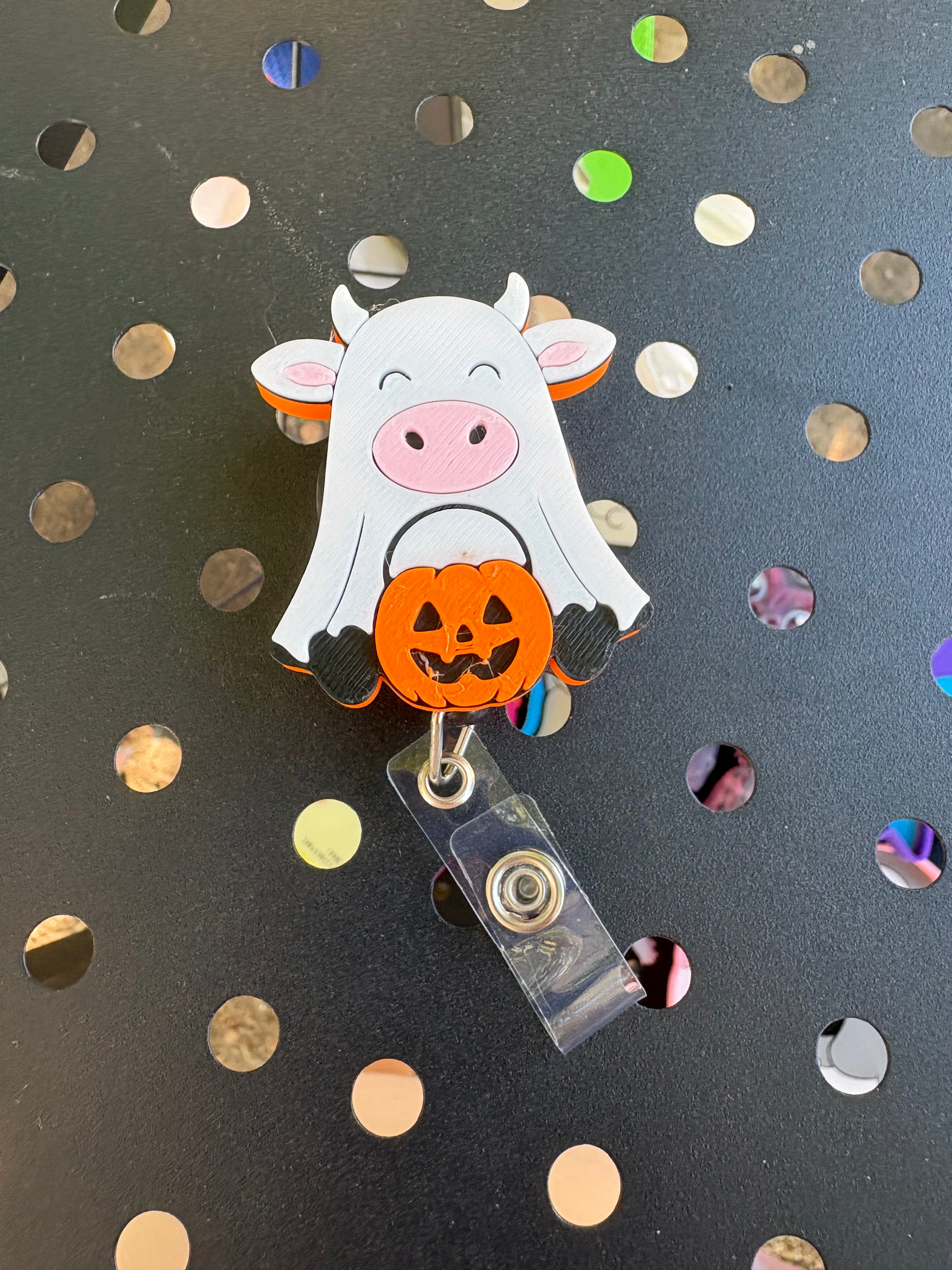 Cow With Pumpkin Badge Reel