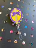 Cross With Bow Badge Reel