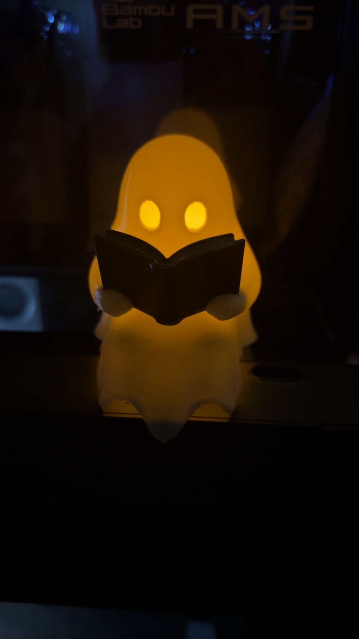 Tea Light Reading Ghost